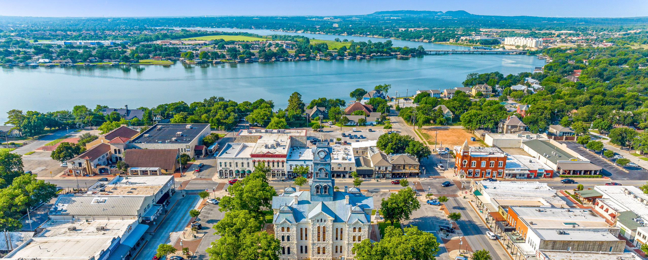 Aerial view of the historic Granbury, Texas town square and courthouse along Lake Granbury, in the area served by Area Security & Access Professionals Locksmith LLC